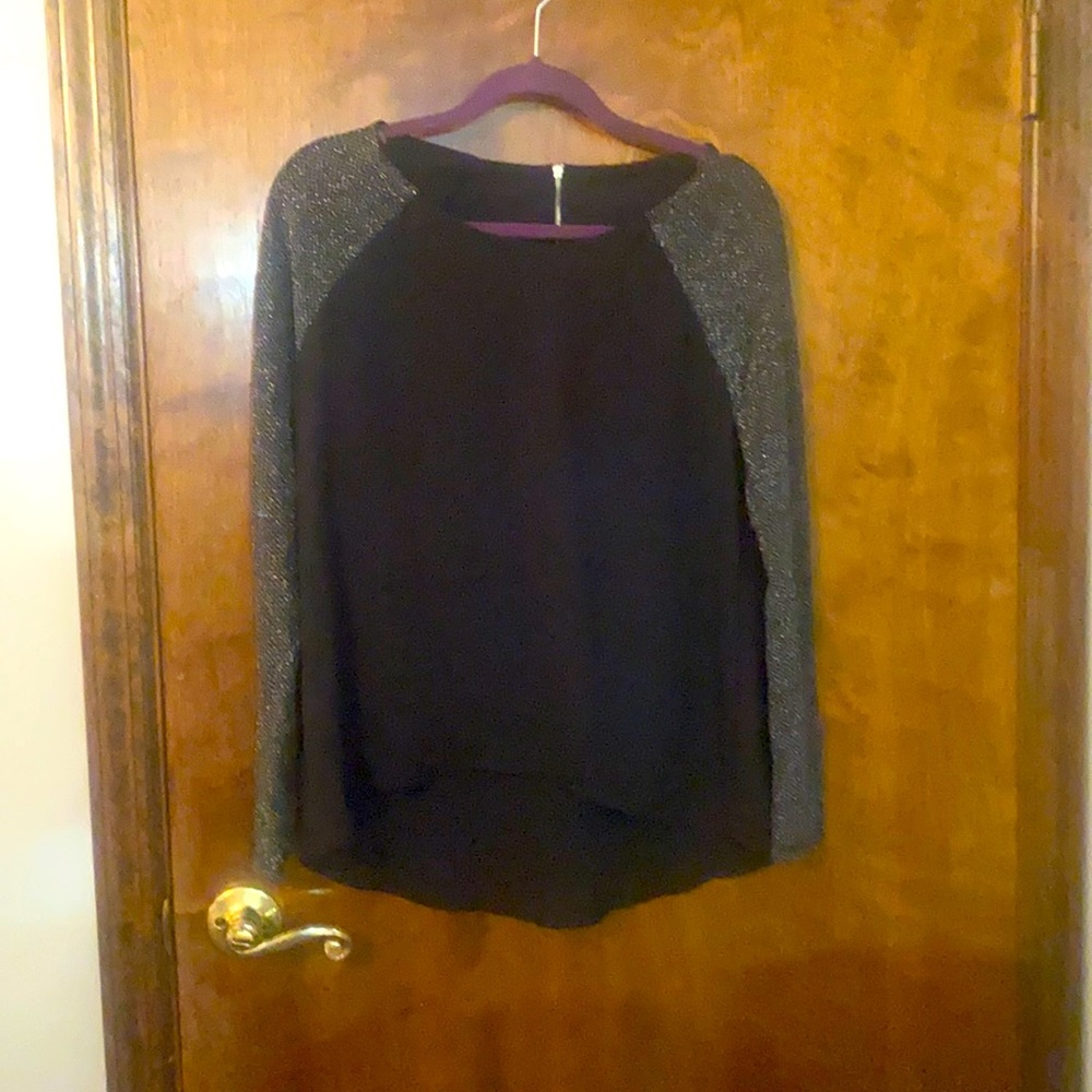 Flowy black top with stretchy metallic silver arms